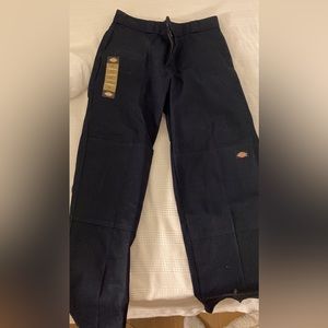 Navy dickies never worn. Size 33/32.